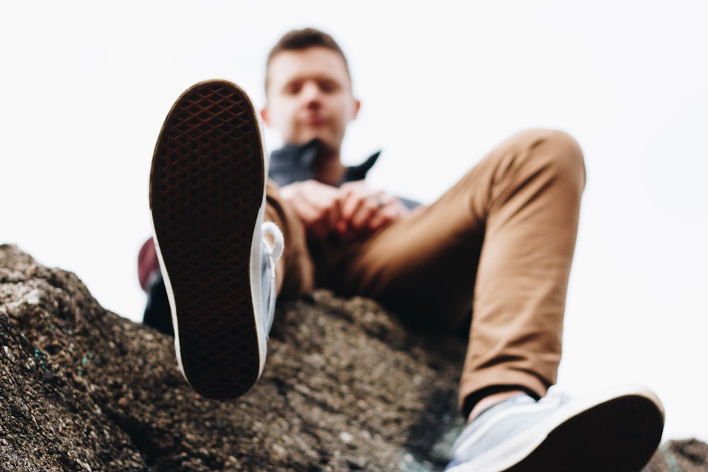 man wearing brown jeans