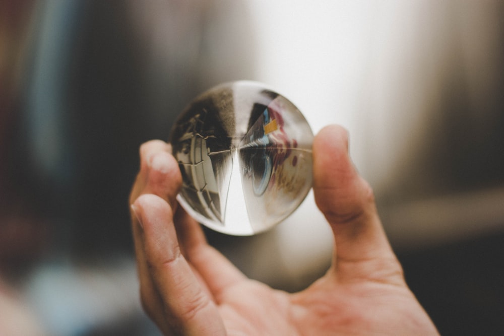 shallow focus photography of clear glass ball