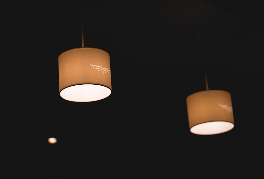 two beige pendant lamps