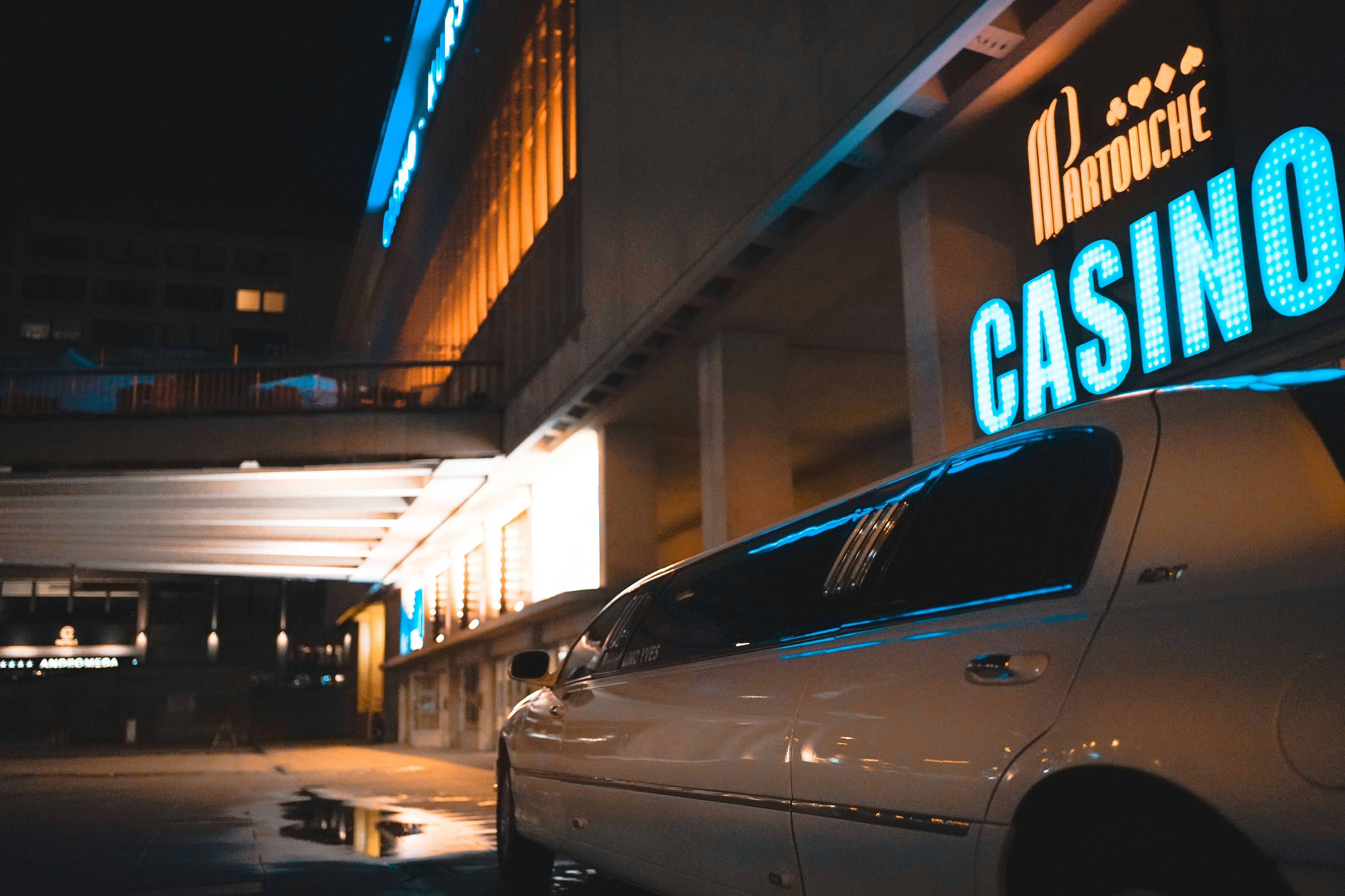 white limousine beside casino
