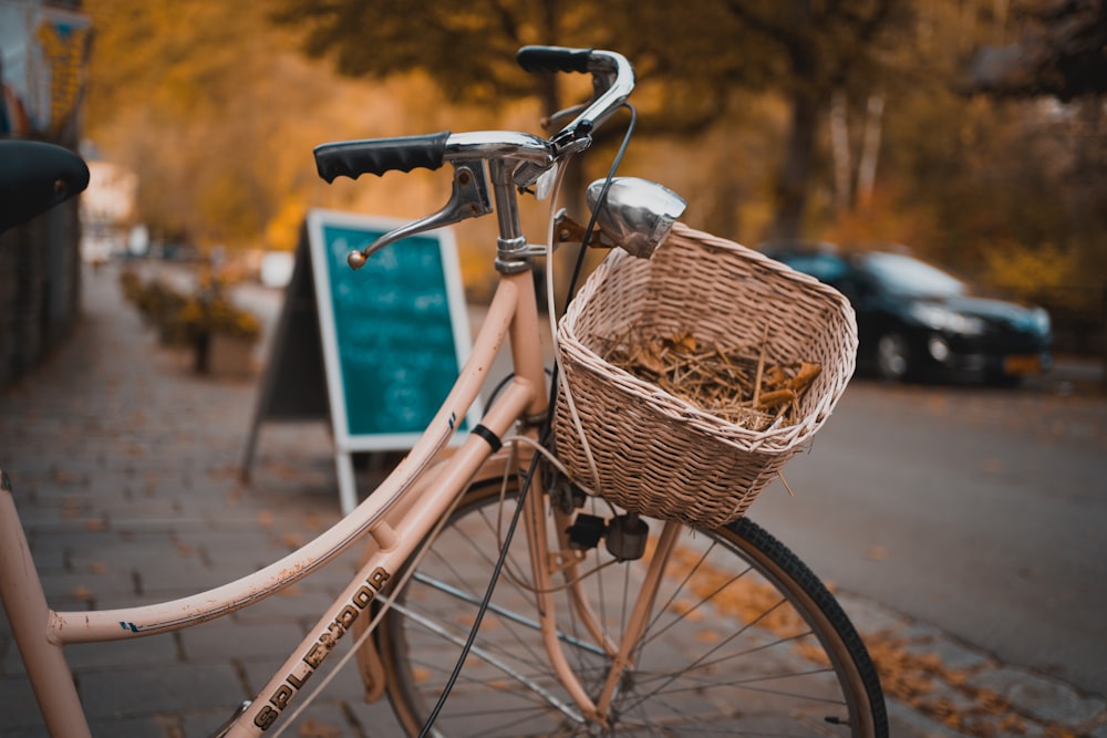 shallow focus photography of brown step-through bicycle