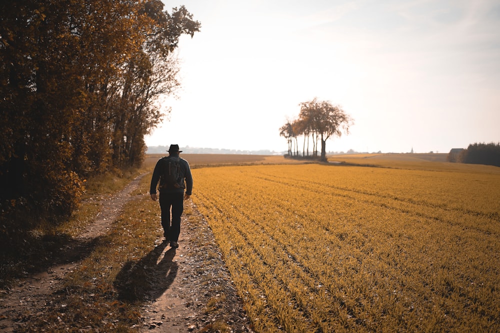 man walking on pathway