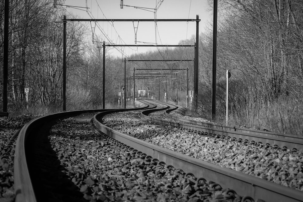 grayscale photography of train rail