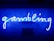 A bright blue neon sign spells out the word 'gambling' in cursive script. The background features a textured wall covered in domino tiles, also illuminated by the blue light, creating a vivid and visually striking scene.