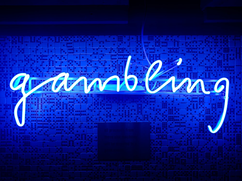 blue gambling neon signage