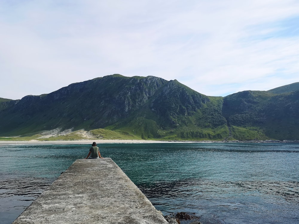 landscape photography body of water and green mountain