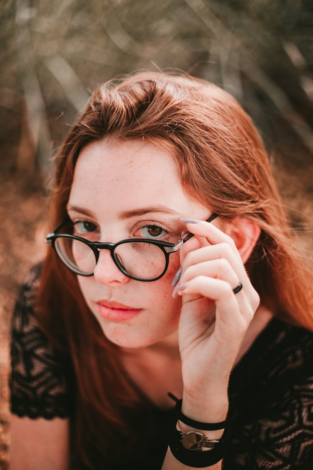 woman wearing black framed eyeglasses