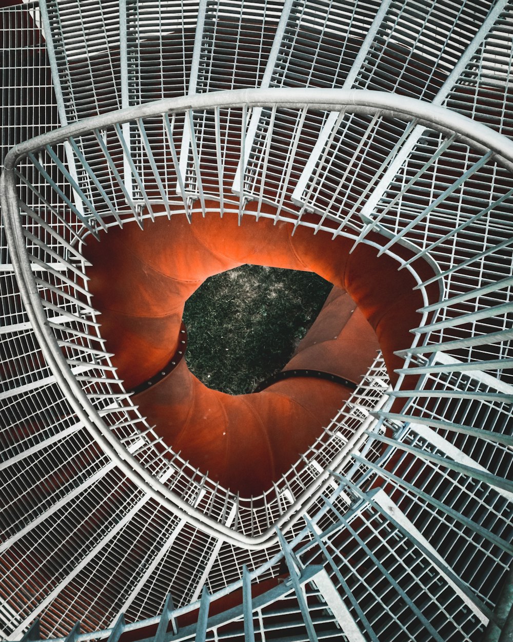 architectural photography of white spiral stair