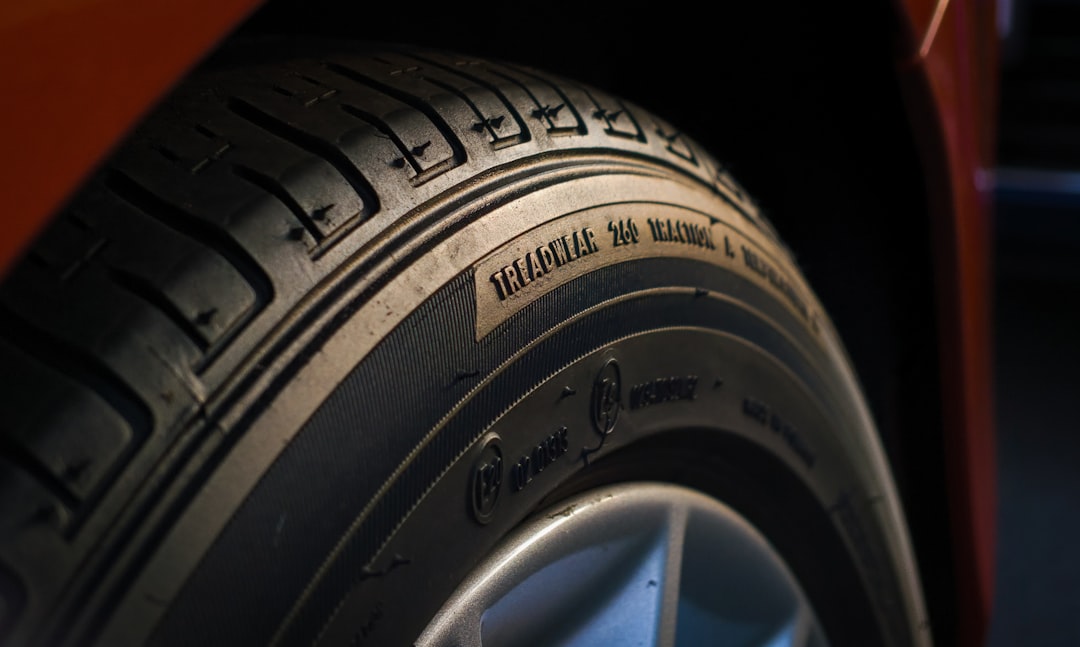 High End rubber tire closeup during sunset, focused on the typography.