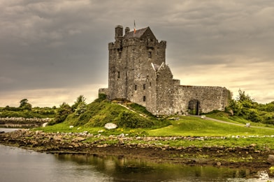 view photography of gray castle on island