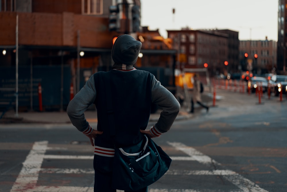 man standing near pedestrian lane