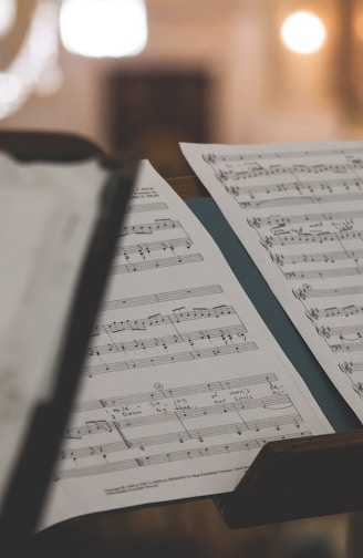 closeup photo of printer paper with musical notes