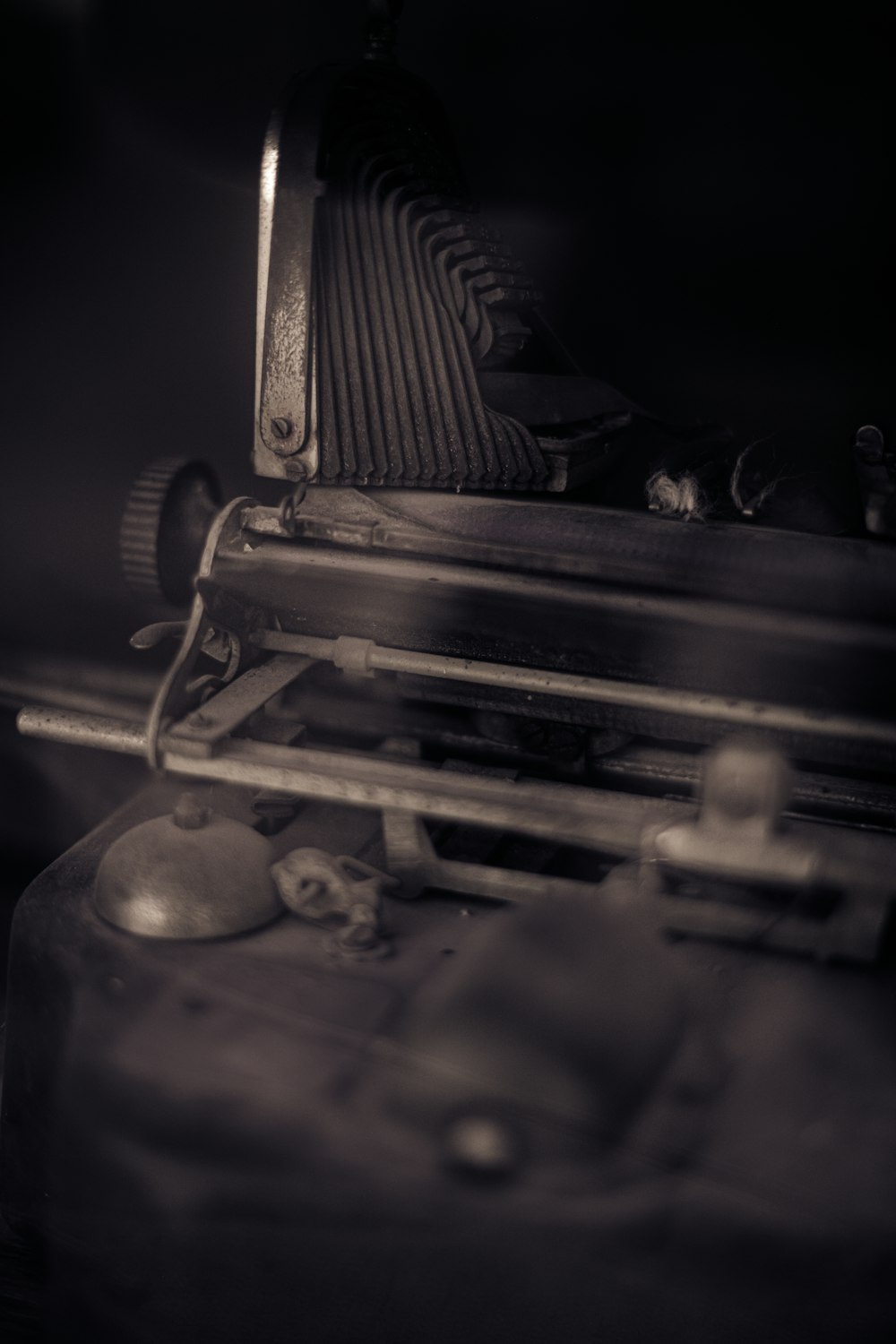 a close up of an old typewriter in a dark room