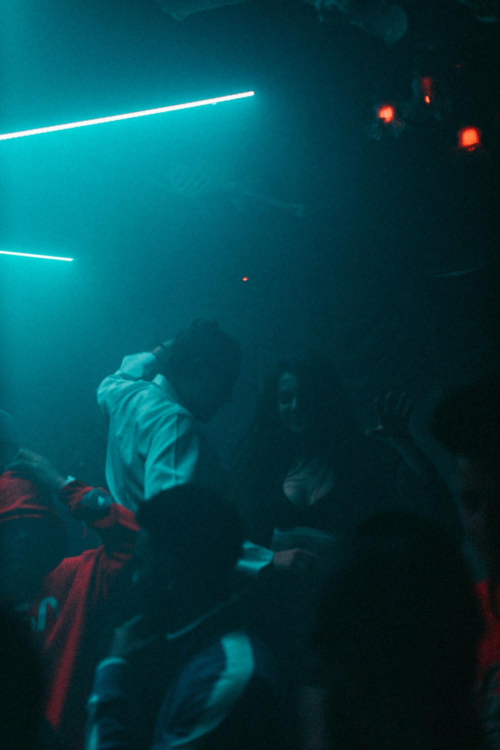 woman and man dancing in dim light