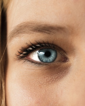 person showing blue eye