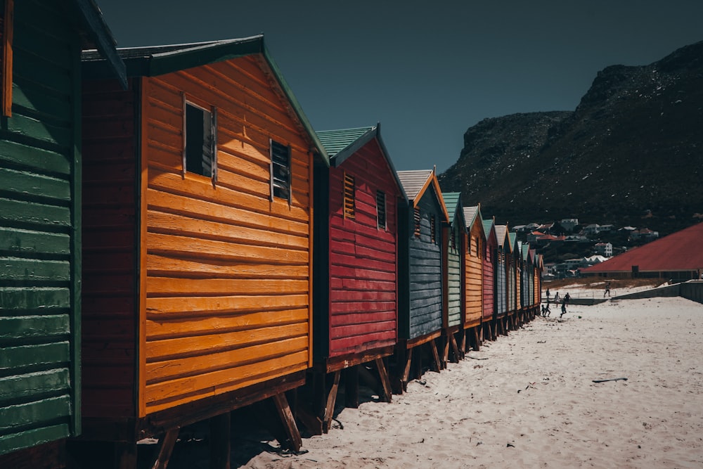 architectural photography of yellow, red, blue, and green wooden houses
