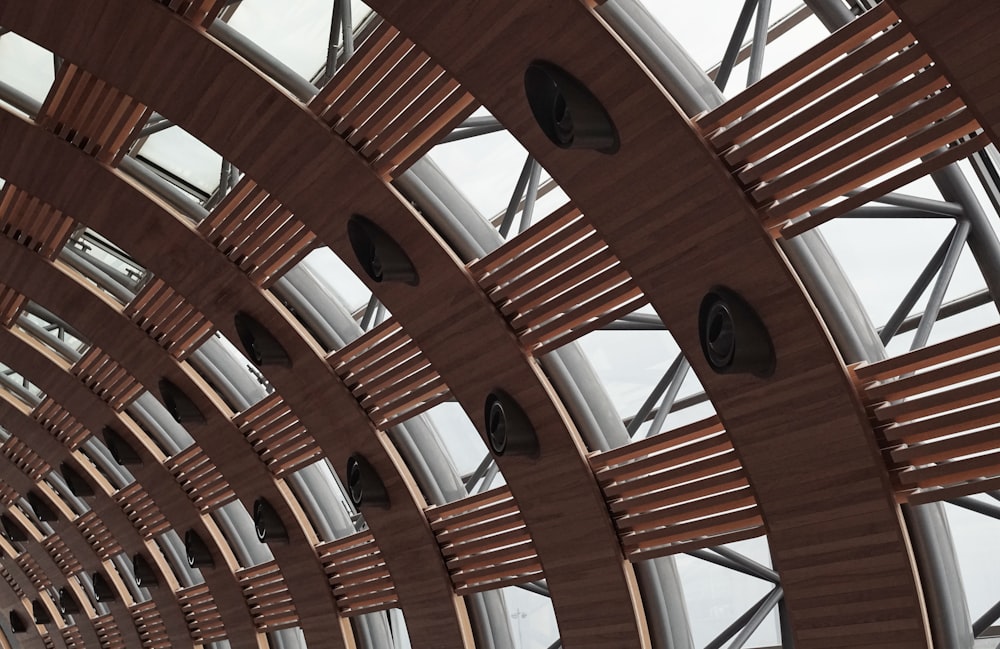 a large wooden structure with a clock on it's side