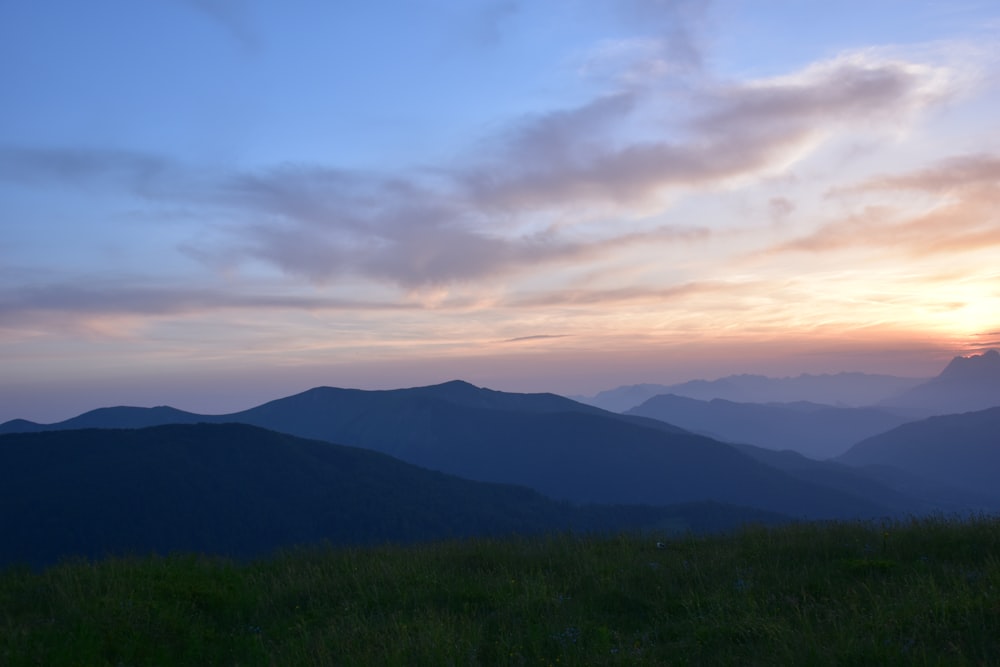 mountain under cloudy sky