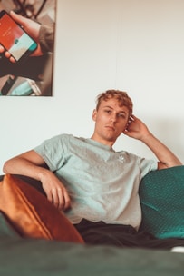 man sitting on sofa
