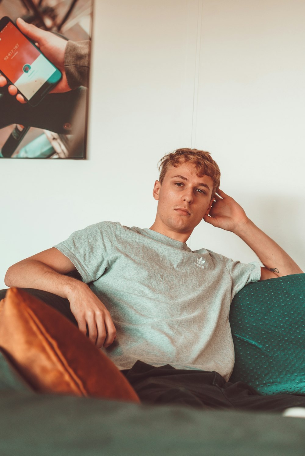 man sitting on sofa