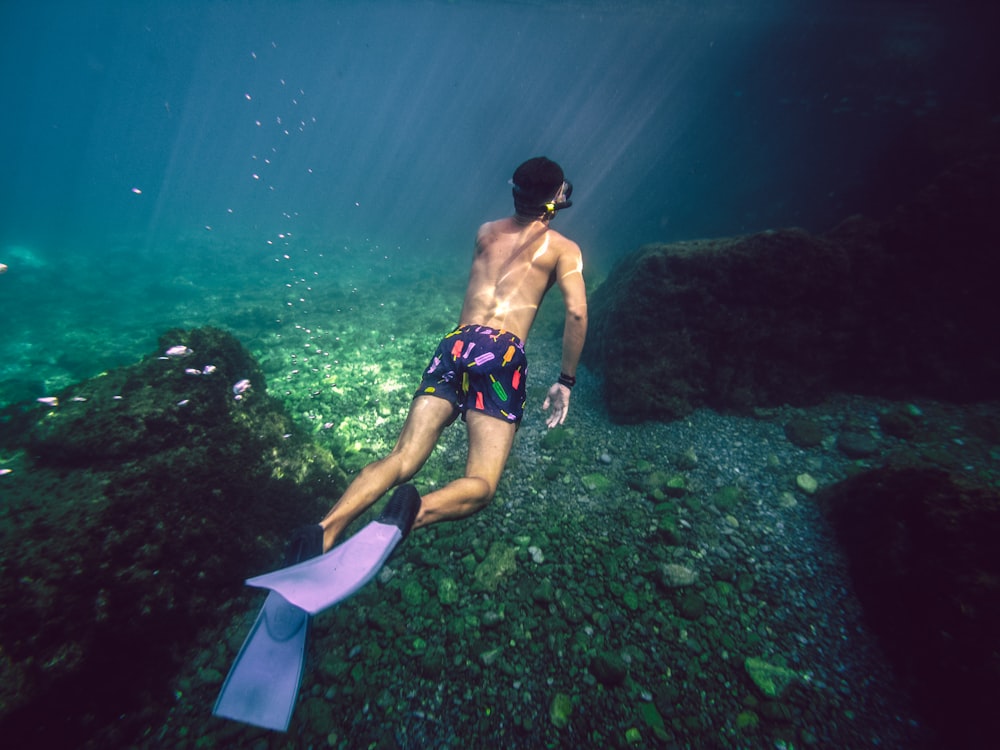 man diving into the waters