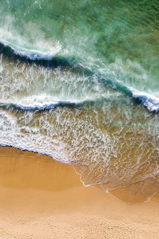 waves rush to shore in Maroubra Beach Australia