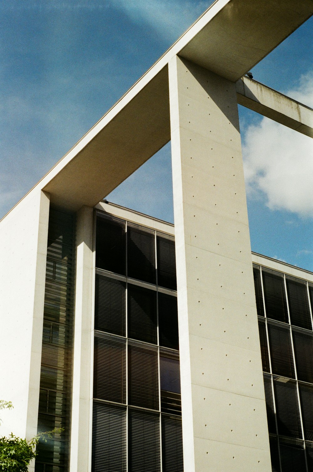 white concrete building under cloudy sky