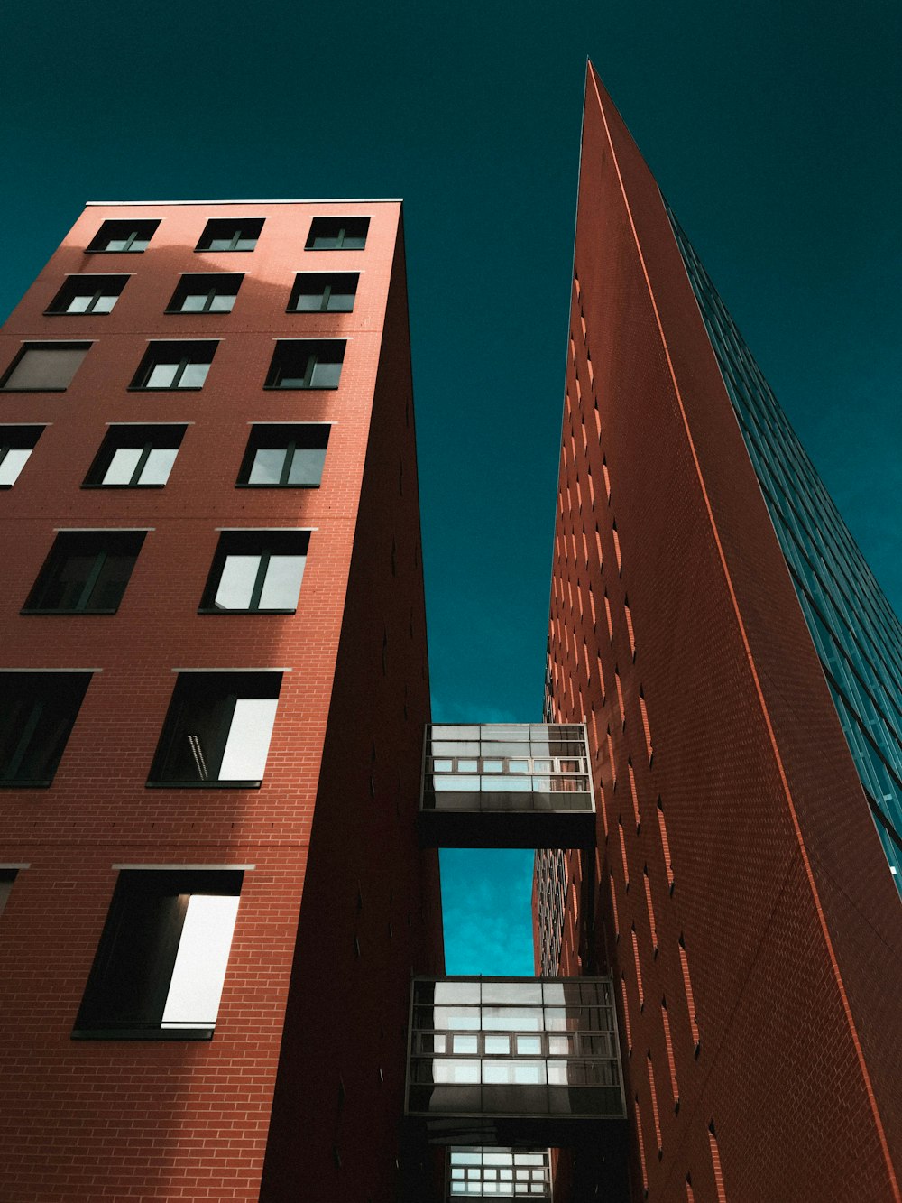 low-angle photography of brown high-rise building during daytime