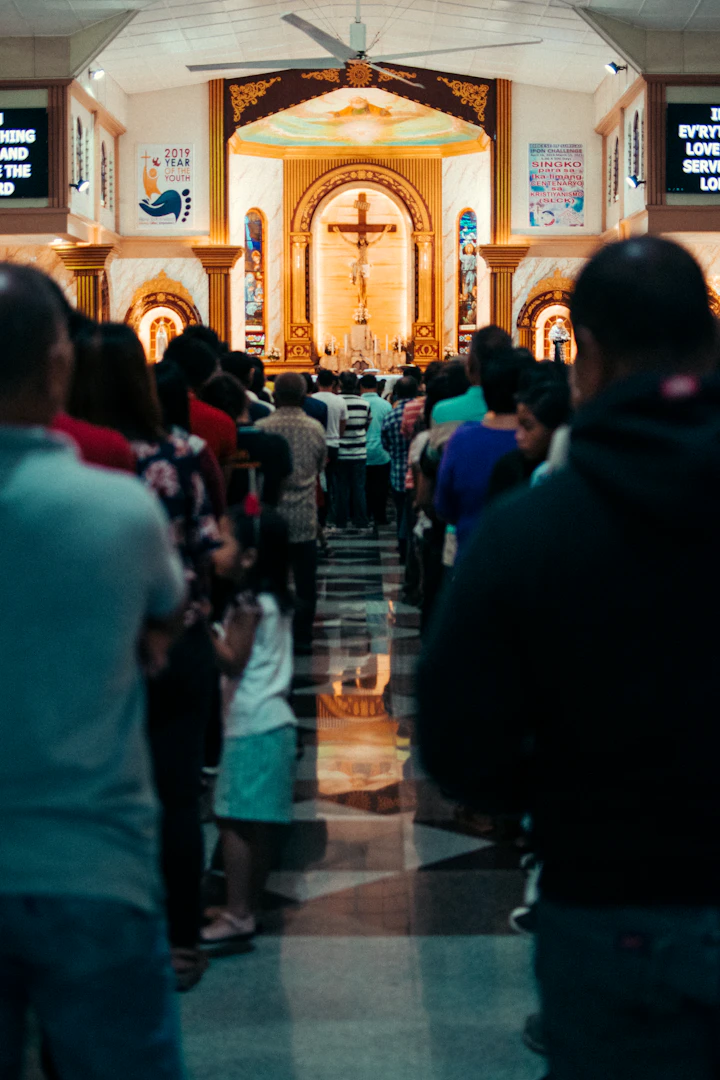 Congregation standing in a warm church interior