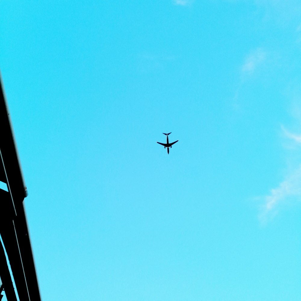 low-angle photography of an airplane in the sky