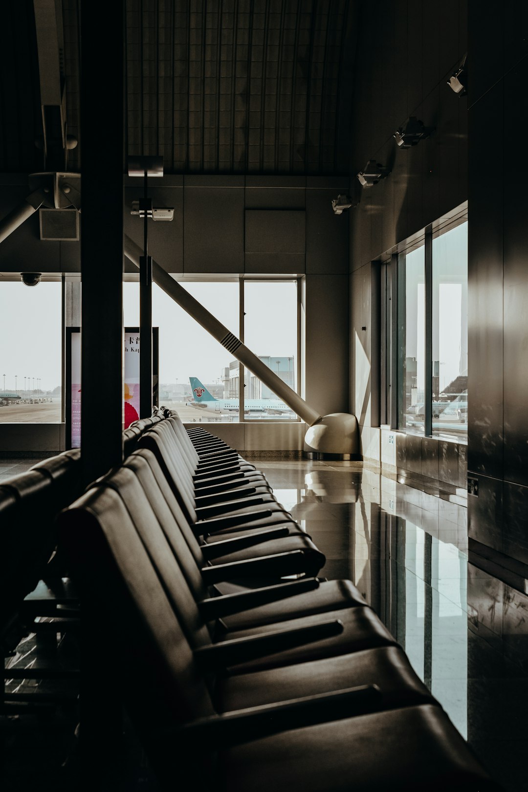 vacant black padded chairs inside building