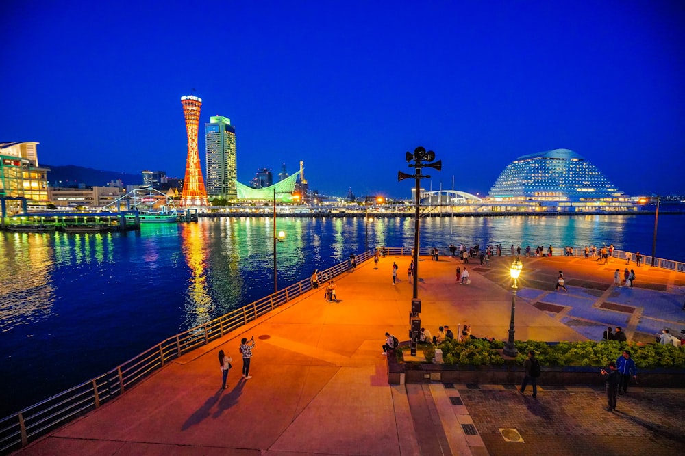 a large body of water with a city in the background