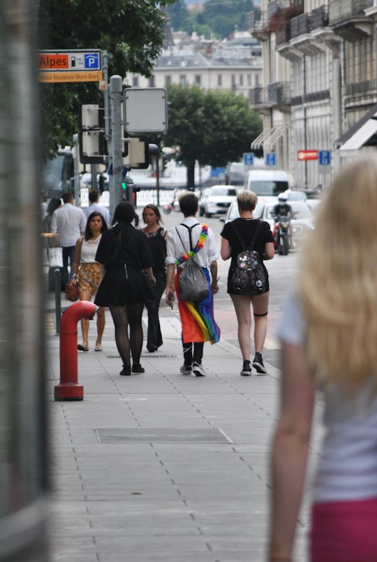 people walking on sidewalk in Geneva Switzerland