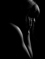 A silhouette of a woman enjoying a moment of self-care.