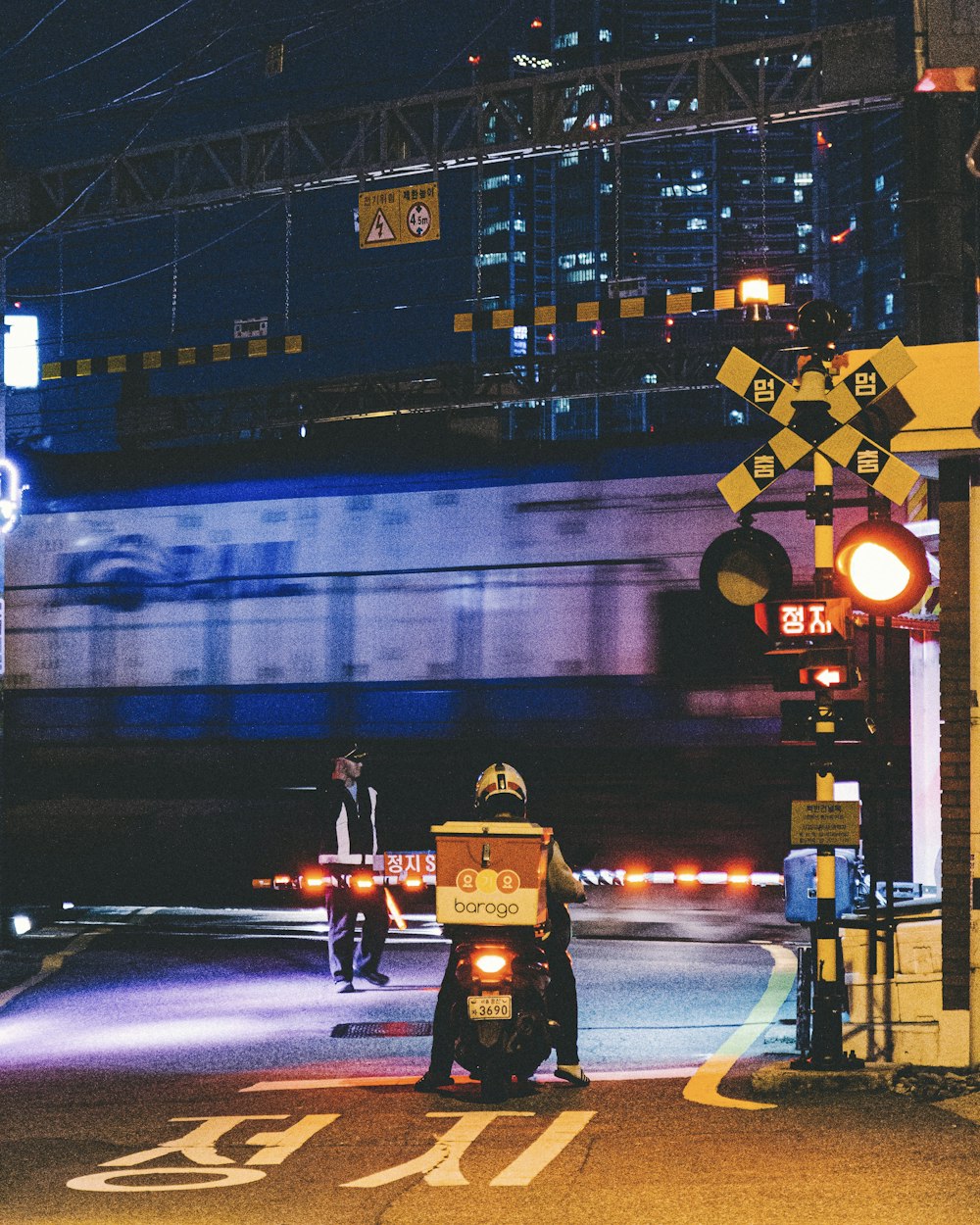 man riding on motorcycle at night