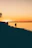 Romantic Latino couple enjoying a sunset on a Caribbean beach during their vacation.