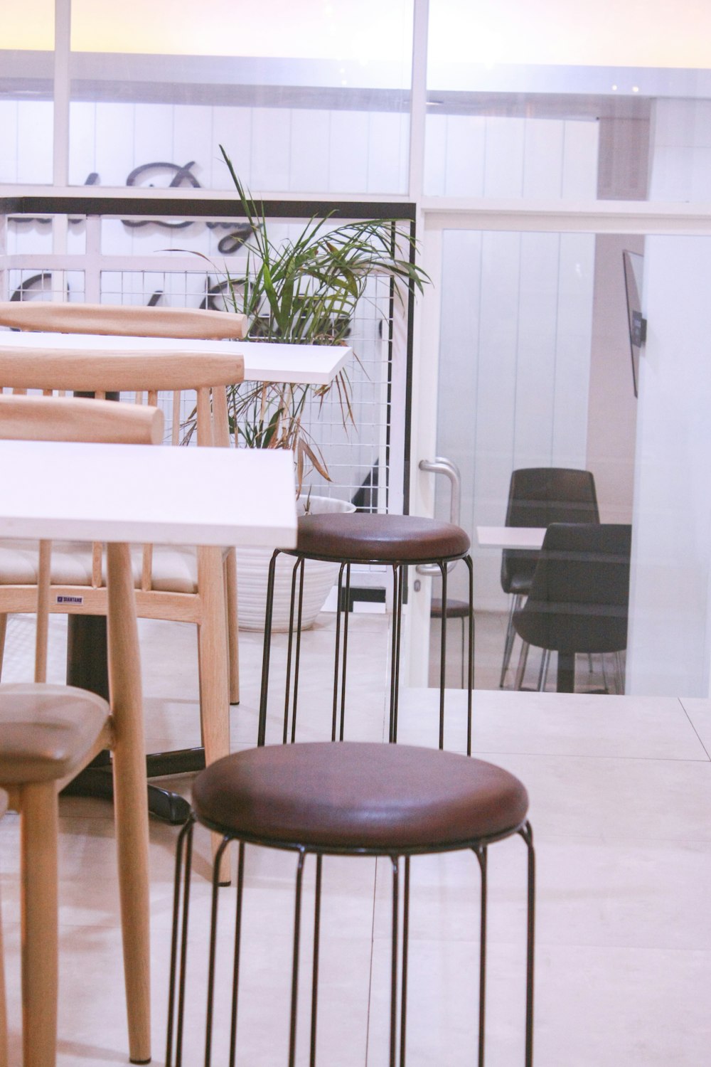 two brown bar stools