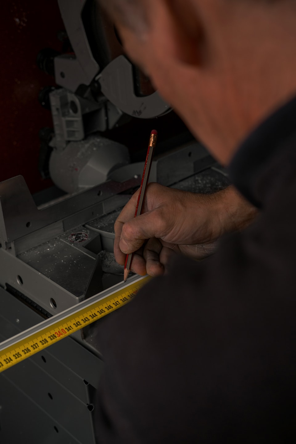 Contractor measuring and estimating on renovation project