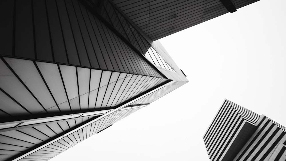 a black and white photo of two tall buildings