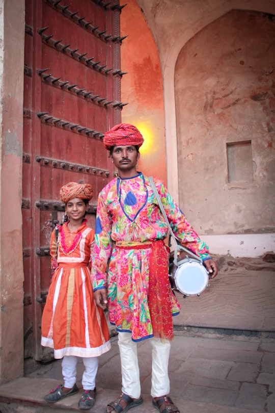 man and girl wearing traditional apparels in Delhi India