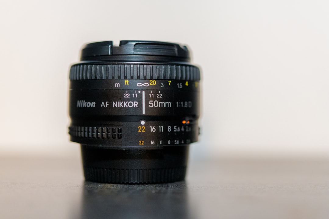 black Nikon AF Nikkor camera lens