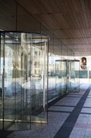 A sleek glass automatic door at a commercial building.
