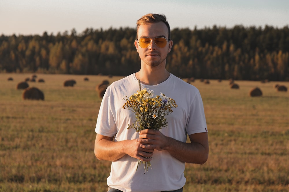 man holding flowers