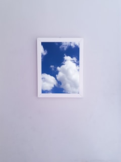 Photo of a framed certification hanging on a clean white wall.