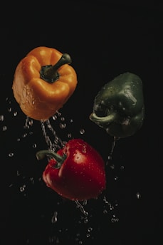 three assorted-color bell peppers