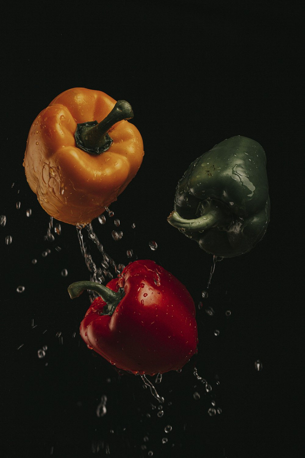 three assorted-color bell peppers