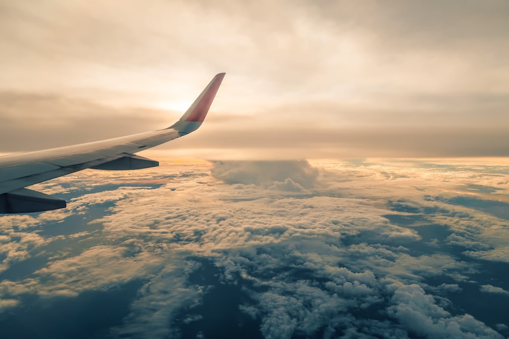 a view of the wing of an airplane in the sky