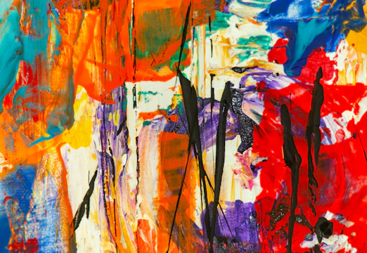 A vibrant abstract painting with bold reds, blues, and yellows blending energetically.