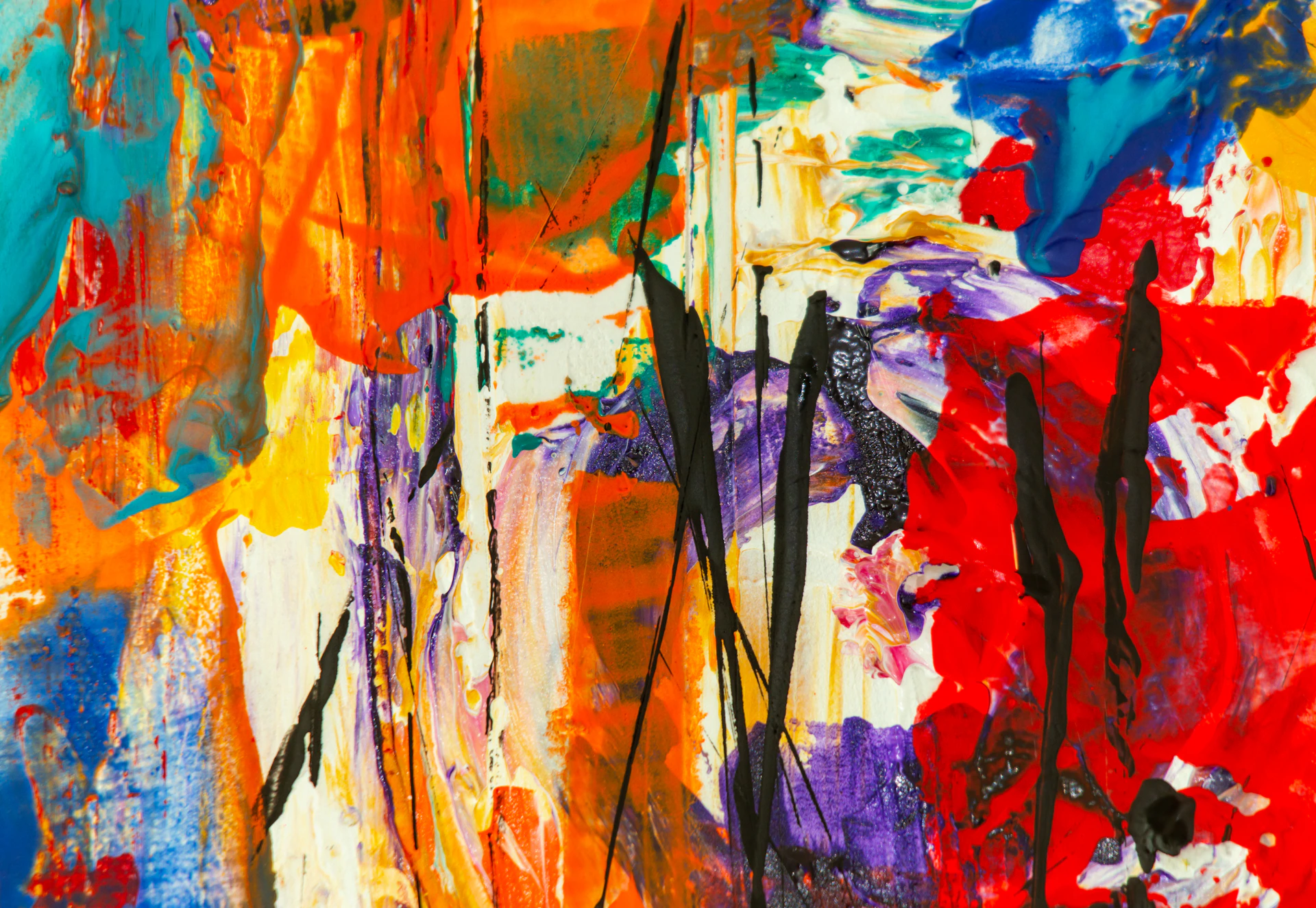 A vibrant abstract painting bursting with bold reds, blues, and yellows, capturing the energy of creative expression.