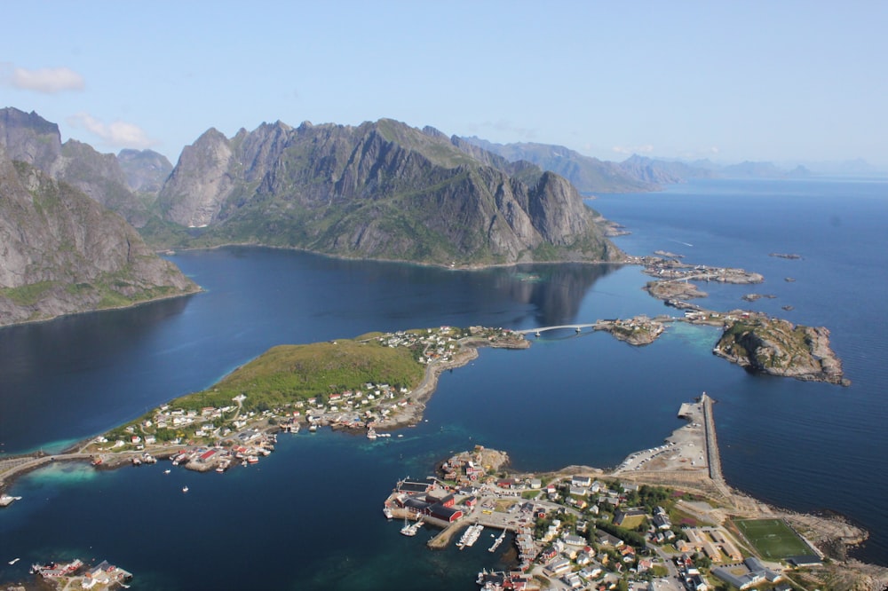 aerial photo of mountain and body of water